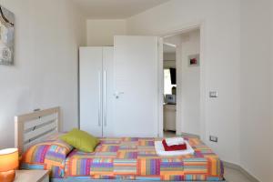 Postel nebo postele na pokoji v ubytování casa perla marina