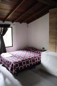 Cama o camas de una habitación en Lulú hostal