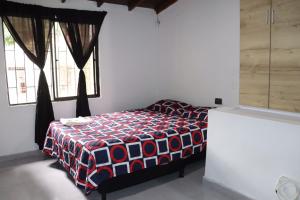 Cama o camas de una habitación en Lulú hostal