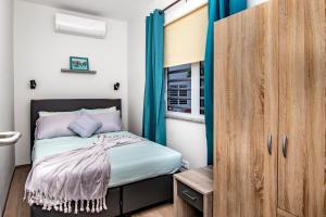 Ένα ή περισσότερα κρεβάτια σε δωμάτιο στο Casa Blue Breeze +17 φωτογραφίες