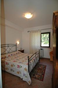 Postel nebo postele na pokoji v ubytování Agriturismo San Vincenzo