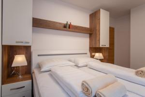 מיטה או מיטות בחדר ב-Apartments Mandre