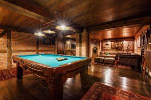 a large room with a pool table in it at WILLA NAD STAWEM MAZURY in Piecki