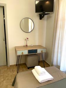 Televízia a/alebo spoločenská miestnosť v ubytovaní Anesi Rooms To Rent