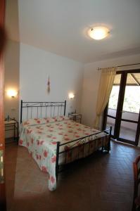 Postel nebo postele na pokoji v ubytování Agriturismo San Vincenzo