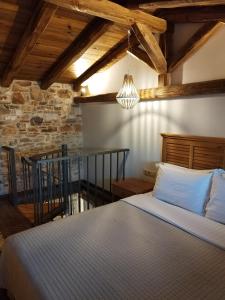 Säng eller sängar i ett rum på Aura di mare luxury house Thassos