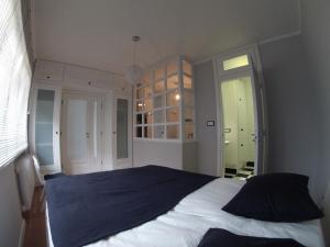 Posteľ alebo postele v izbe v ubytovaní Apartament Black & White w Centrum Gdyni III