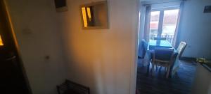 a dining room with a table and chairs and a window at Lustica Bay/Radovici in Tivat +15 photos