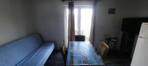 a living room with a couch and a table and a window at Lustica Bay/Radovici in Tivat