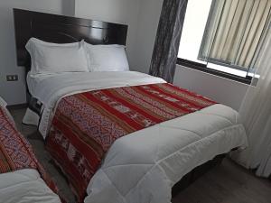 Hostal Killaly Inn Cusco客房内的一张或多张床位