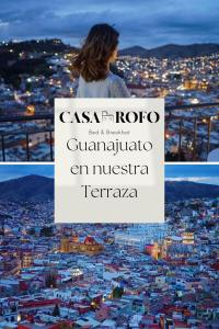 a woman looking over a city at night at Casa Rofo in Guanajuato