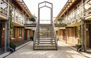 a stairway in a building with a metal ladder at Apt 3 Hohen Wieschendorf in Hohen Wieschendorf +32 photos