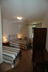 Postel nebo postele na pokoji v ubytování Agriturismo San Vincenzo