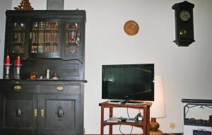 a living room with a tv and a dresser and a tvicterictericter at Awesome Home In Fischbach With 2 Bedrooms in Fischbach