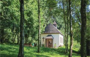 a small chapel in the middle of a forest at Ferienhaus 2 Wolfschlucht in Gondenbrett