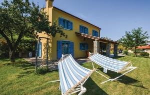 two hammocks in front of a house at Awesome Home In Koper With 3 Bedrooms And Wifi in Koper