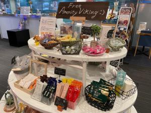 a shelf with many different products on it in a store at Matsue Urban Hotel in Matsue