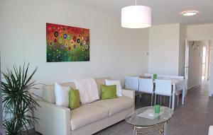 a living room with a couch and a painting on the wall at Residentie Crystal Ref 93 in Ostend