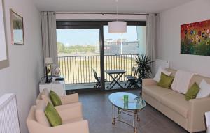 a living room with a couch and a table at Residentie Crystal Ref 93 in Ostend