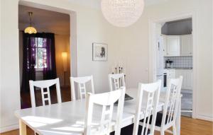 A restaurant or other place to eat at Amazing Apartment In Ystad With Kitchen