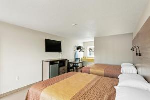 Posteľ alebo postele v izbe v ubytovaní Siesta Inn McAllen