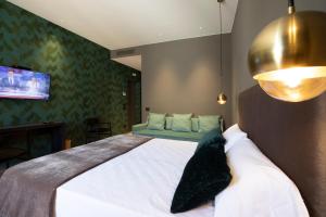 Postel nebo postele na pokoji v ubytování Re Sale Boutique Hotel
