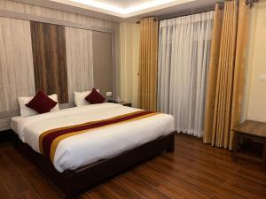 Katil atau katil-katil dalam bilik di Hotel Murano