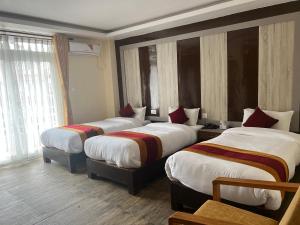 Katil atau katil-katil dalam bilik di Hotel Murano