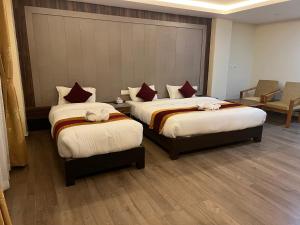 Katil atau katil-katil dalam bilik di Hotel Murano
