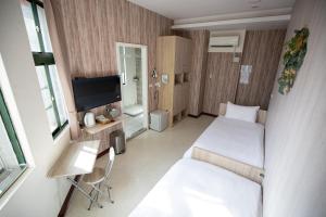 TV a/nebo společenská místnost v ubytování Jia-Jia Business Hotel
