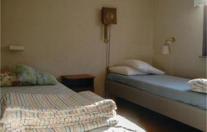 Кровать или кровати в номере Nice Home In Borrby With 3 Bedrooms And Wifi
