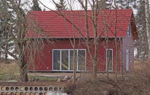 a red house with a red roof at 2 Bedroom Nice Home In Gnoien Ot Dölitz in Gnoien