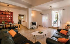 a living room with a couch and a table at Lovely Home In Kotor With Wifi in Kotor