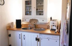 a kitchen counter with a sink and a microwave at Stunning Home In Spangenberg With Wifi in Spangenberg