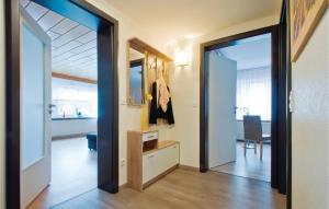 a hallway with a door open to a living room at Amazing Apartment In Bad Peterstal-griesb, With 2 Bedrooms And Wifi in Bad Griesbach