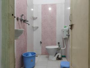a bathroom with a toilet and a sink at House No 87A in Jaipur +48 photos