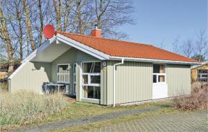 a small shed with an orange roof at Frische Brise 7 - Dorf 2 in Priwall