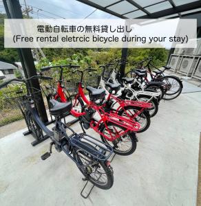 a group of bikes parked next to each other at BATONWORKS Naoshima in Naoshima