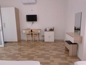 TV a/nebo společenská místnost v ubytování Homestay Tulip Garden Bảo Lộc