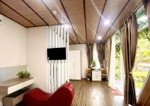 TV a/nebo společenská místnost v ubytování Homestay Tulip Garden Bảo Lộc