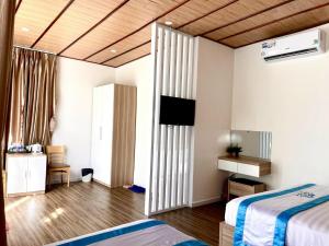 TV a/nebo společenská místnost v ubytování Homestay Tulip Garden Bảo Lộc