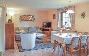 a living room with a table and a couch at Lovely Apartment In Winterberg-altenfeld With Wifi in Winterberg