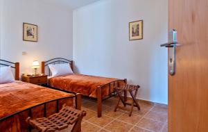 En eller flere senge i et værelse på Aphrodite House