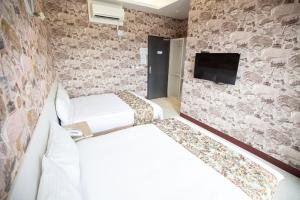 TV a/nebo společenská místnost v ubytování Jia-Jia Business Hotel