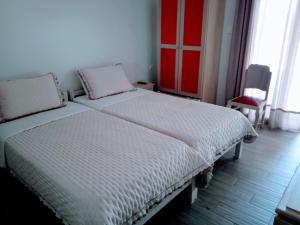 Postel nebo postele na pokoji v ubytování MELI-IOS