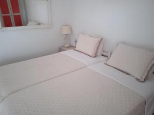 Postel nebo postele na pokoji v ubytování MELI-IOS
