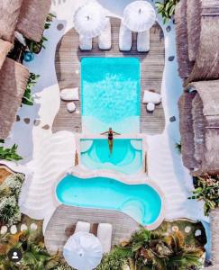 an overhead view of a pool at a resort at Gravity Eco Boutique Hotel - Adults Only in Uluwatu