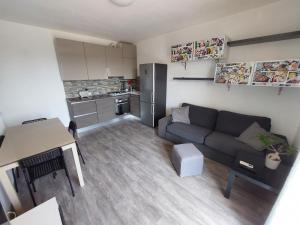 a small living room with a couch and a kitchen at Casa Laura in Ventimiglia +43 photos