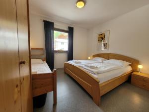 Postel nebo postele na pokoji v ubytování Profelt`s Apartments Uttendorf - Steinbock Lodges