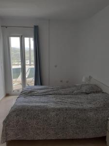 Postel nebo postele na pokoji v ubytování Estepona Golf Apartment